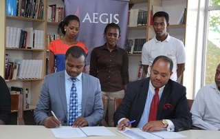 Freddy Mutanguha of the Aegis Trust signs MoU with Ambassador Mussie Hailu for URI Africa